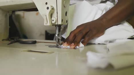 african man sewing tissue