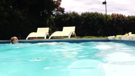 sibling swimming in the pool