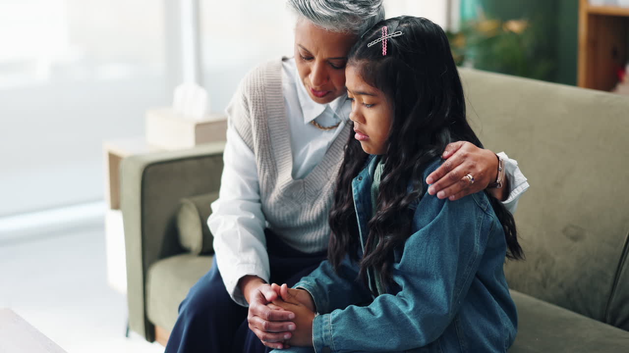 A comforting moment between a grandmother and granddaughter