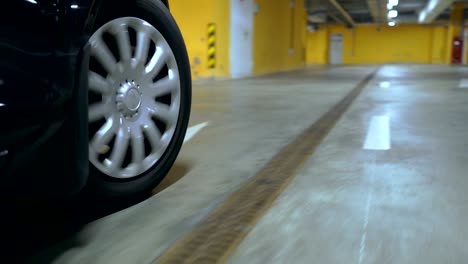 the front wheel of a moving car. the camera is mounted near the wheel.