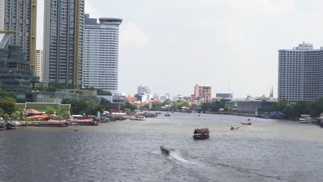 chao phraya river in bangkok city with boats and ships in thailand