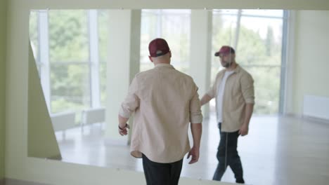 man breakdancing in modern studio