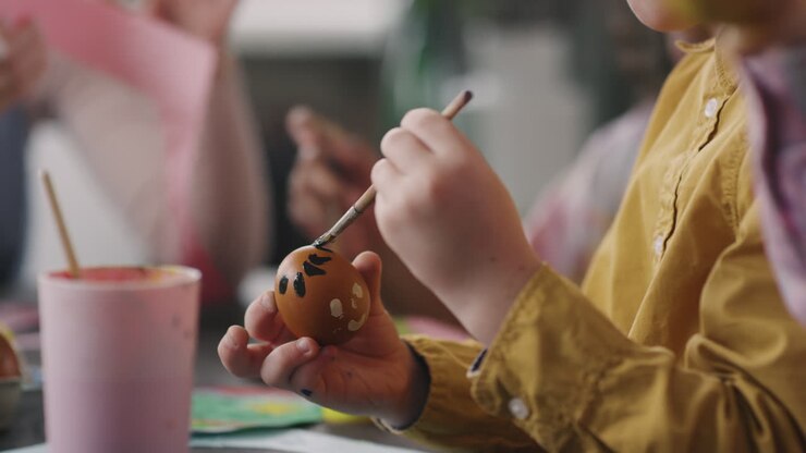 Boy Decorating Easter Egg