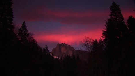 wide shot of red sky above half dome in yosemitenationalpark