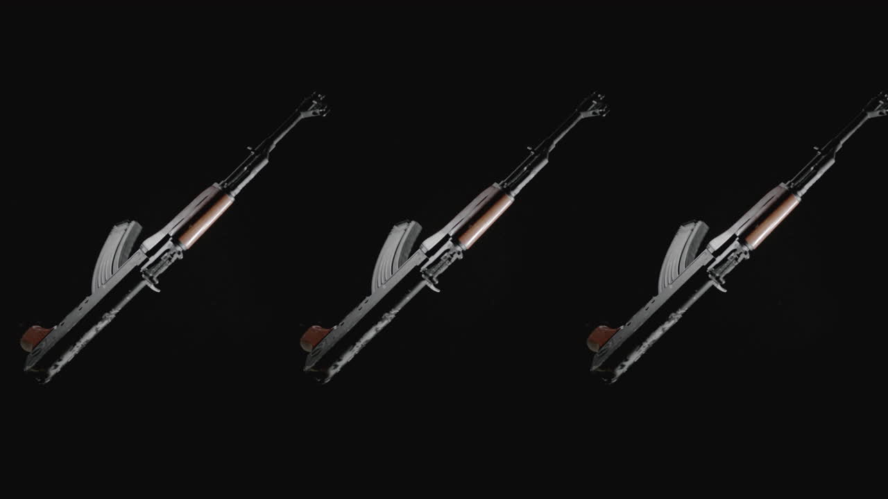 Machineguns on the dark background rotate in slowmotion