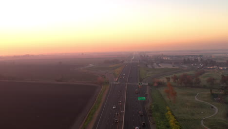 interstate 99 freeway at sunrise. highway going through california central valley, drone view