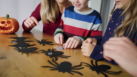 handheld video shows of family preparing decorations for halloween