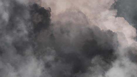 approaching the surface of a thick, dark cumulonimbus cloud with a thunderstorm