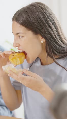woman enjoying a muffin