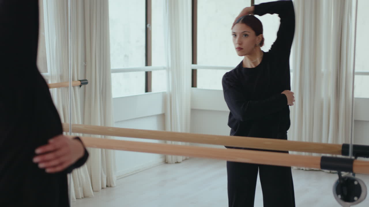 Female Dancer Practicing Contemporary Dance in front of Mirror