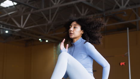 Woman-warming-up-indoors