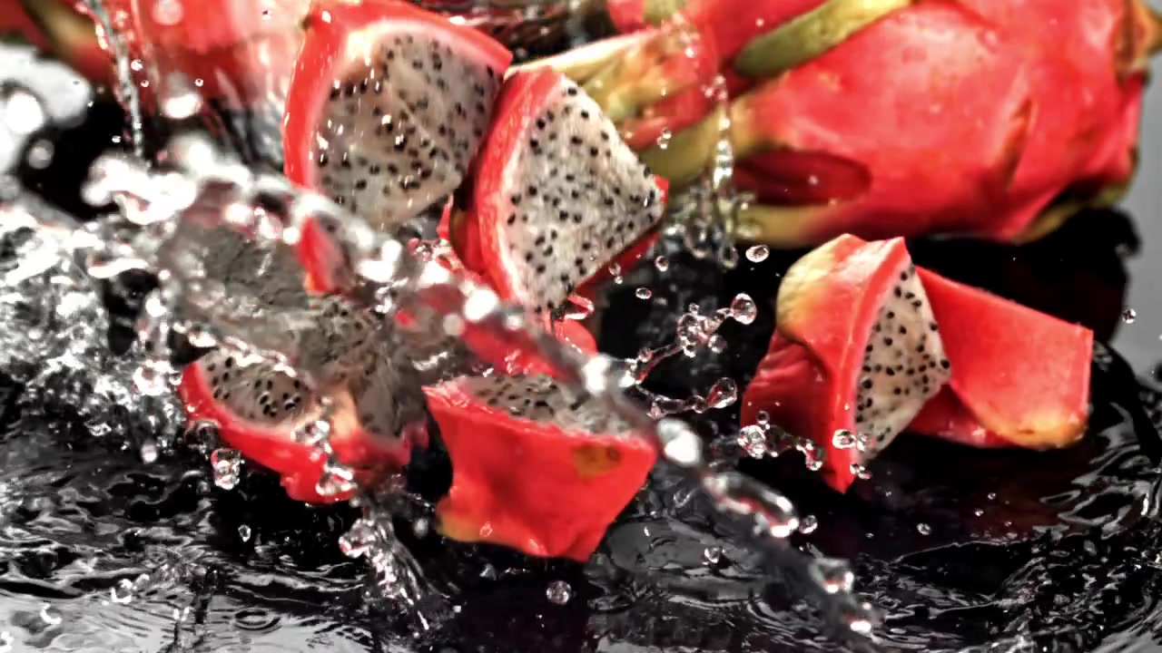 Slow Motion of Fresh Dragon Fruit Pieces Splashing into Water