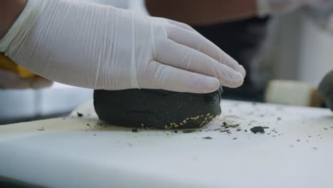 A-professional-chef-is-preparing-a-hamburger-in-his-kitchen---03