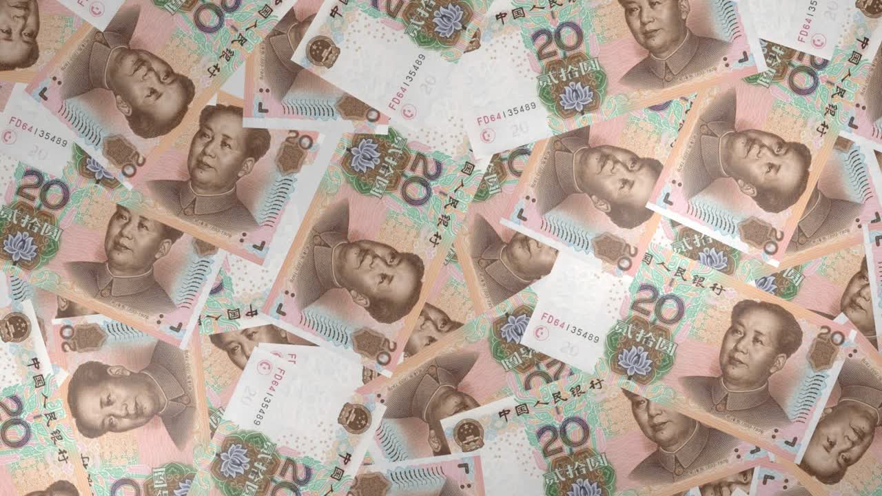 중국의 20 위안 지폐의 배경에는 많은 지폐가 있습니다.