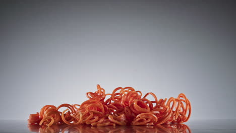 Sliced-carrots-falling,-slow-motion