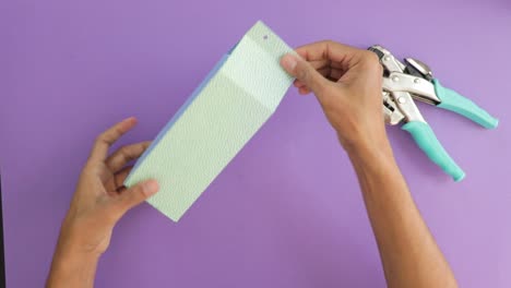 how to use a hole punch on paper