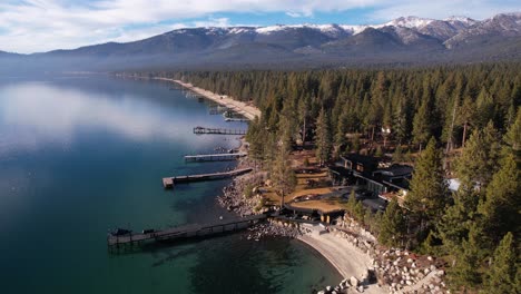 Aerial-View-of-Idyllic-Waterfront-of-Lake-Tahoe-USA,-Lakefront-Homes,-Docks,-Calm-Water-and-Pine-Forest,-Drone-Shot