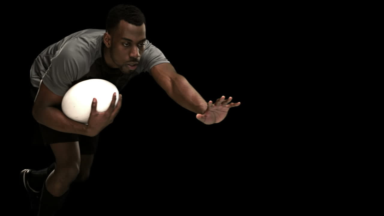 Serious rugby player playing in slow motion