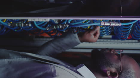it professional working on server cables in a data center