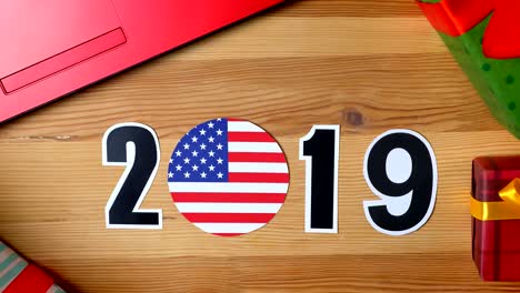 illustration, new year, male hand put on the table on american flag, country ball, 2019