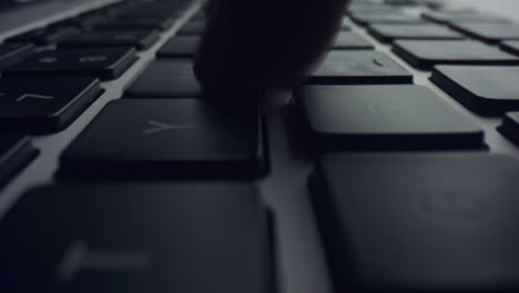 male hand typing on laptop. closeup man using laptop computer