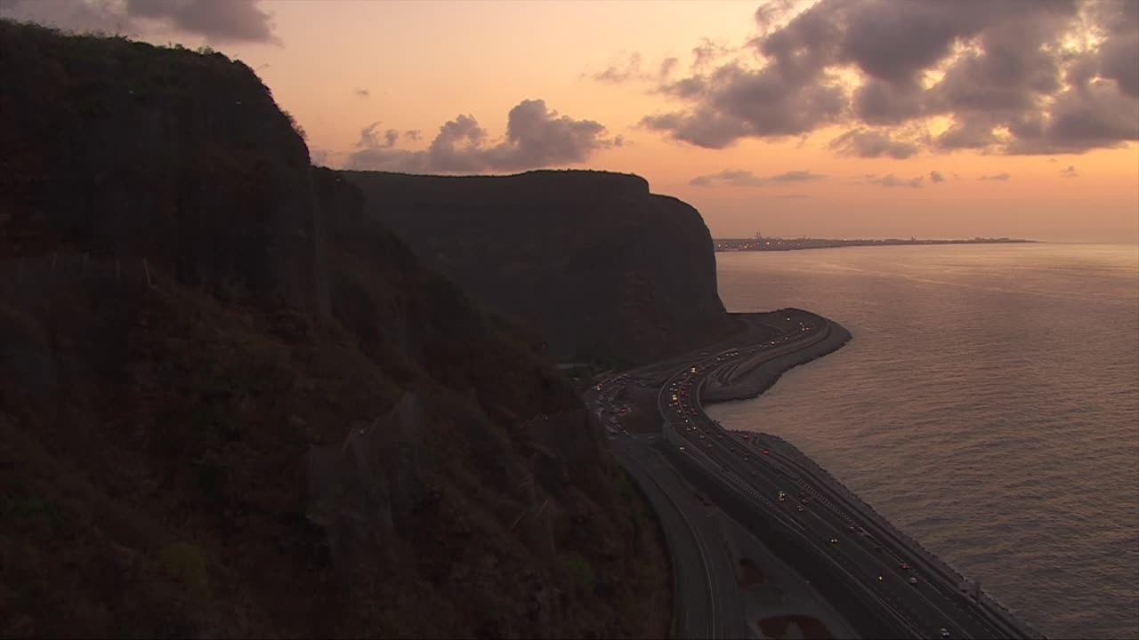 Tropical Island Coastline Road of Reunion, France, Aerial View at Sunset