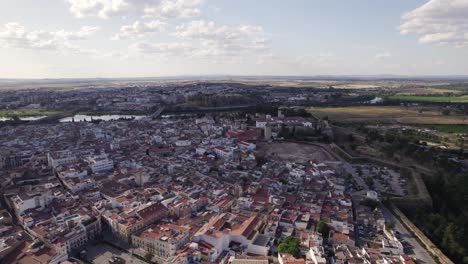 establishing shot of badajoz cityscape with alcazaba ancient citadel, orbiting shot