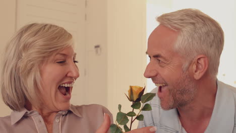 Man-giving-his-wife-a-yellow-rose