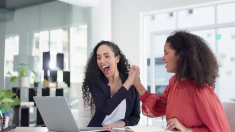 Laptop,-success-and-business-women-high-five-to
