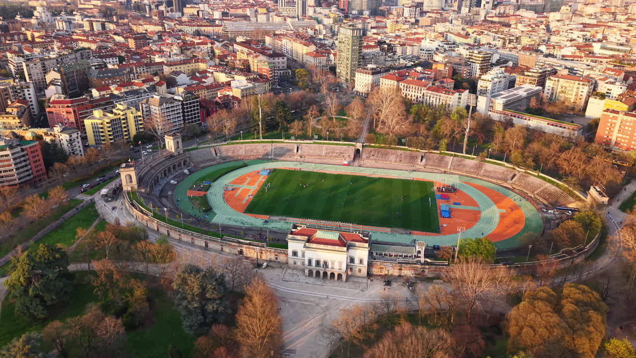 Aerial drone view of the Arena Civica surrounded by buildings in Milan, Italy