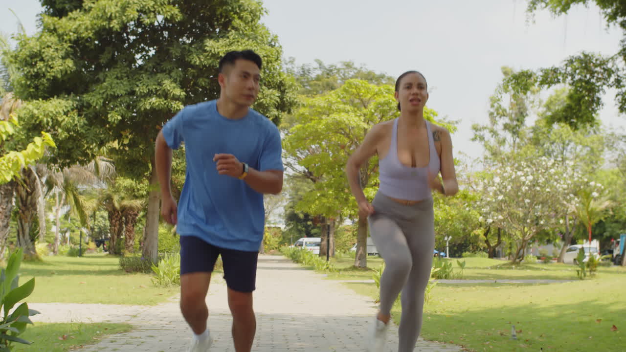 Intercultural People Having Jog in Sunny Park