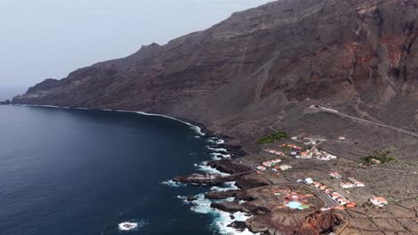 tunnel cuts through steep cliffs near las puntas village, roques de salmor coast