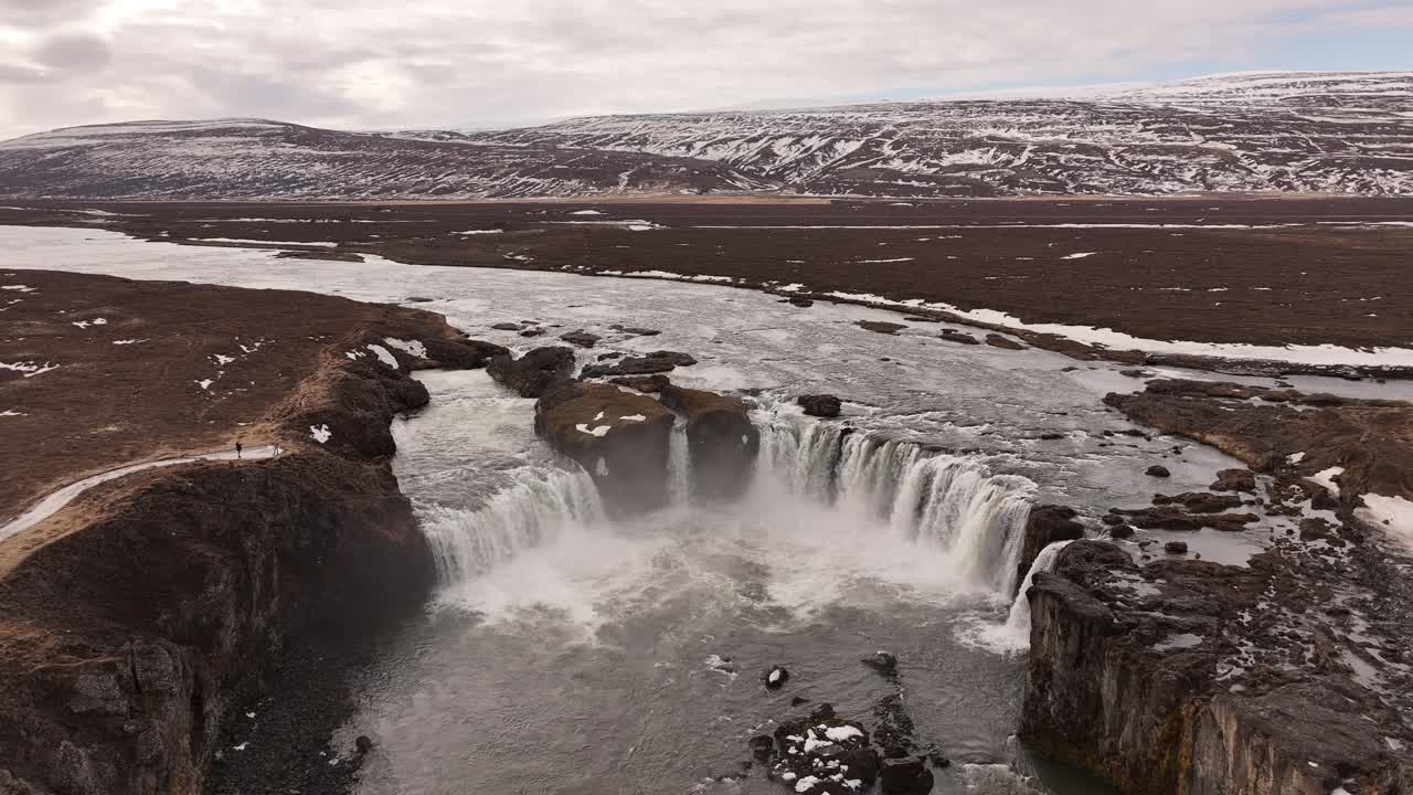 Goðafoss, the "Waterfall of the Gods," powerfully cascades over the Skjálfandafljót river in North Iceland, near Laugar. A majestic, historic site renowned for its stunning horseshoe shape