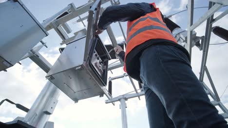 setting up equipment at a transformer substation. construction of a transformer substation