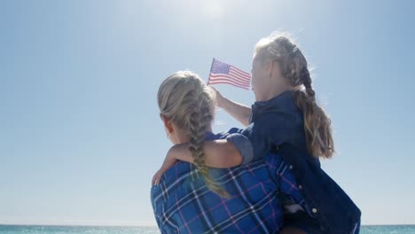 woman and her daughter enjoying free time on the beach together