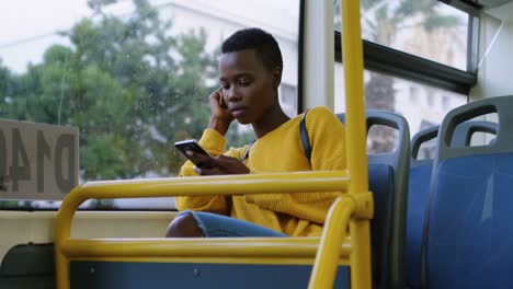 woman using mobile phone while travelling in bus 4k