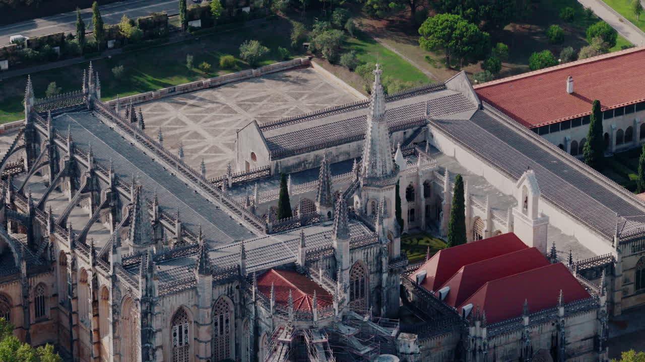Mosteiro da Batalha top‑down nadir shot, steady descent revealing cloister grid and roof geometry