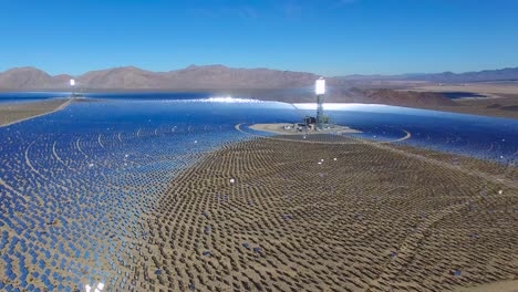 a beautiful aerial over a vast concentrated solar power farm in the mojave desert 4