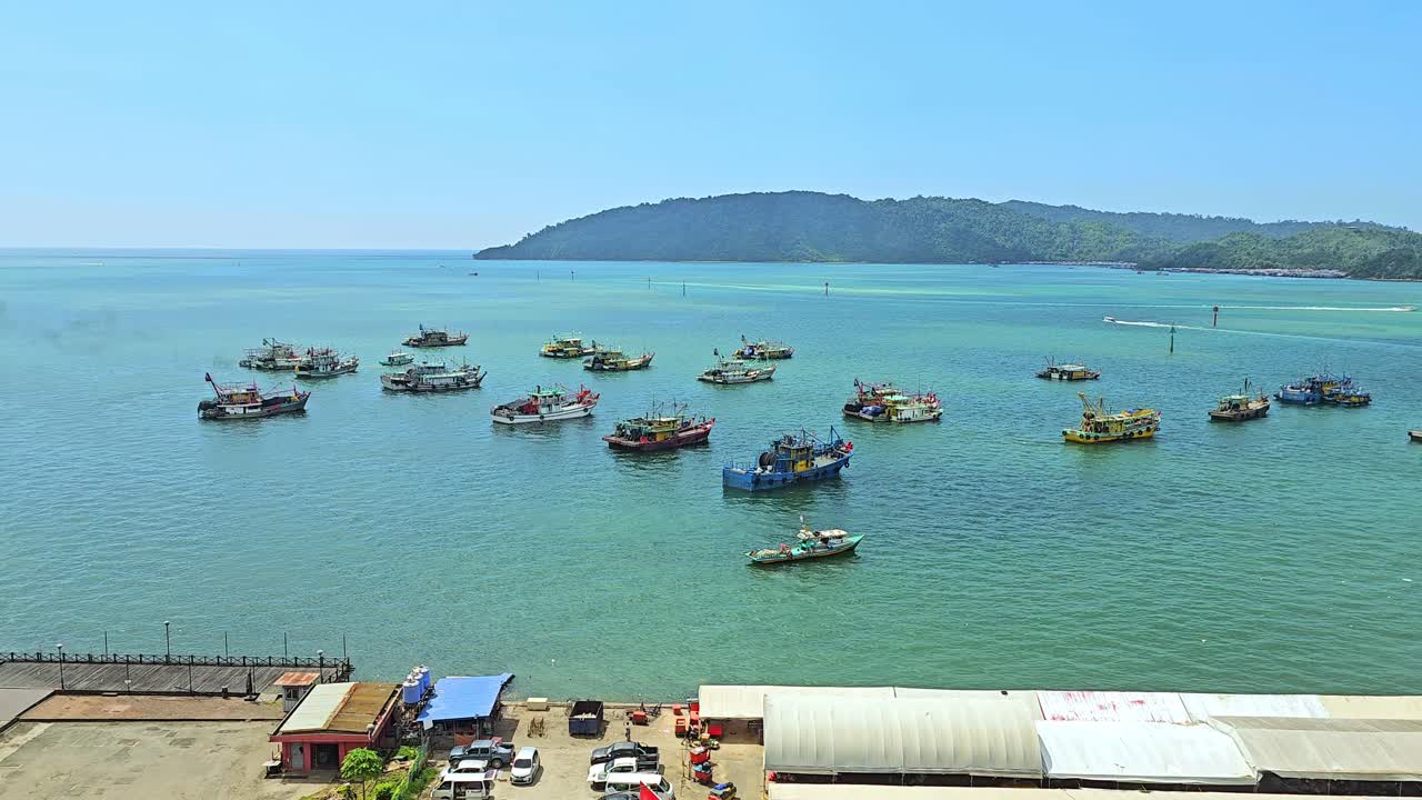 Fishing Boats On The Harbour Near The Shore Of Kota Kinabalu In Sabah, Malaysia. wide static shot