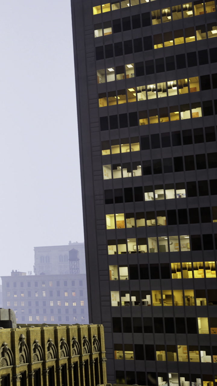 Twilight city skyline with lit office spaces and modern buildings