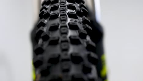 Panning-shot-of-bike-tyre-inside-studio