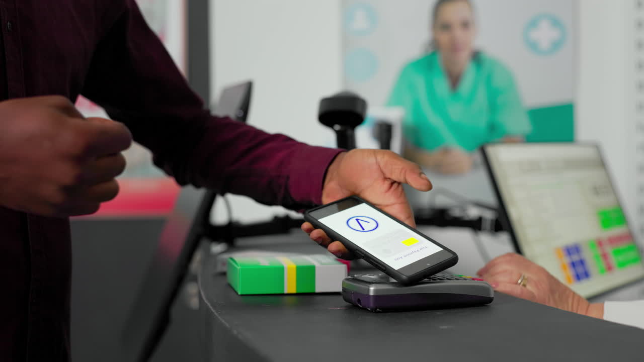 Customer making contactless payment at pharmacy