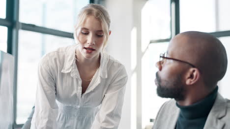business colleagues discussing work in office
