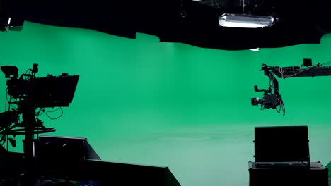 the studio lights turn on and the studio is ready for filming. professional crew on big budget filmmaking. on film studio set shooting historical movie or tv show green screen scene.