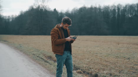 Young-man-flying-a-drone-outside-4