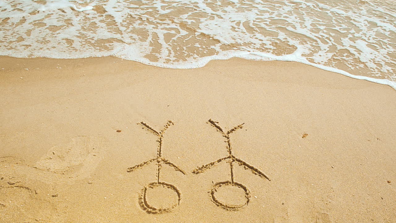 Små män på sand. Små män på sand, sköljs bort