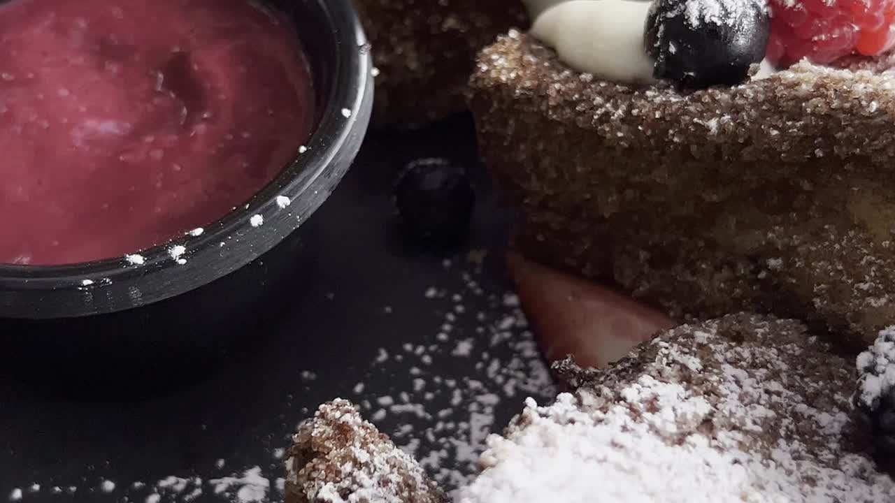 delicious and tempting chocolate cakes with berries and sugar