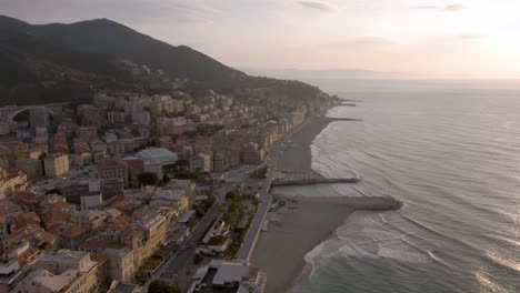 drone shot of a beautiful spring sunrise at the coast of west italy in varazze