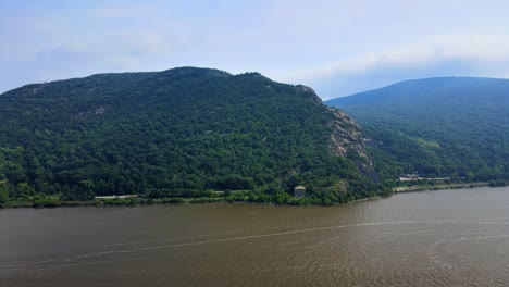 aerial drone video footage of breakneck ridge mountain in new york's hudson valley overlooking the historic hudson river in the hudson highlands