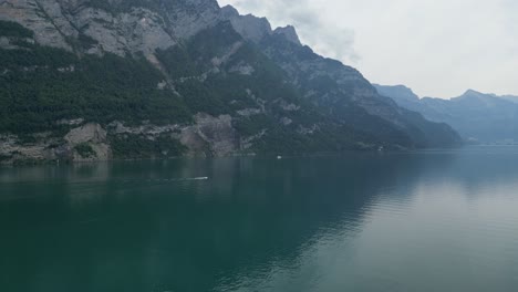 Lake-landscape-with-cloudy-sky-and-motorboat